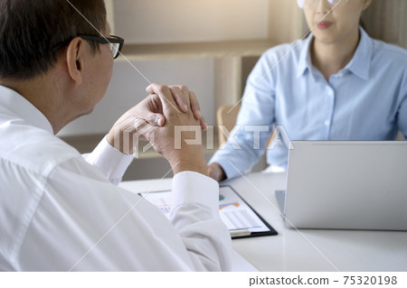 businesswoman and man creative business team colleagues talking 75320198