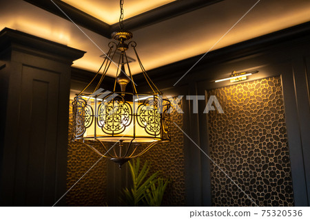 metal lamp in oriental style on the ceiling of the interior 75320536