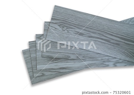 Vinyl tiles for home interior design for house renovation. New wooden pattern vinyl tile. Vinyl flooring material. Polymer vinyl sheet for new home floor. PVC material isolated on white background. Vinyl tiles for home interior design for house renovation. New wooden pattern vinyl tile. Vinyl flooring material. Polymer vinyl sheet for new home floor. PVC material isolated on white background. 75320601