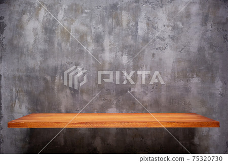 Wooden book shelf at abstract wall background, concrete or putty texture 75320730