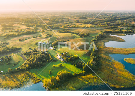 Braslaw Or Braslau, Vitebsk Voblast, Belarus. Aerial View Of Peninsula Maskovichi Near Nedrava Lake. Landscape In Sunny Morning. Top View Of Beautiful European Nature From High Attitude. Bird's Eye Braslaw Or Braslau, Vitebsk Voblast, Belarus. Aerial View Of Peninsula Maskovichi Near Nedrava Lake. Landscape In Sunny Morning. Top View Of Beautiful European Nature From High Attitude. Bird's Eye 75321169
