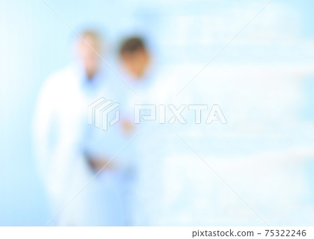 blurry image, out of focus. doctors in white coats. background with copy-space. blurry image, out of focus. doctors in white coats. background with copy-space. 75322246