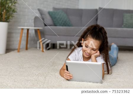 little child girl using digital tablet 75323362