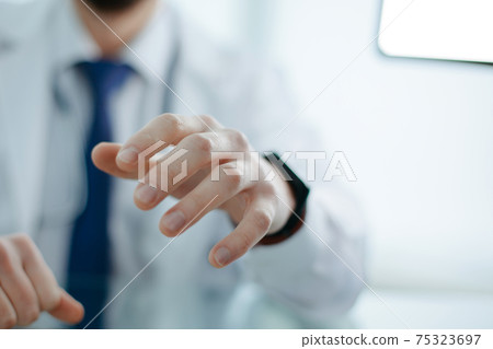 close-up. image of a doctor in a white coat. close-up. image of a doctor in a white coat. 75323697
