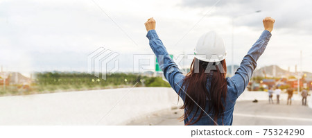Banner Woman engineer entrepreneur constrcution industry worker. Panoramic Female engineer working refinery oil plant manufacturing. Young civil engineering construction wear hardhat safety helmet 75324290