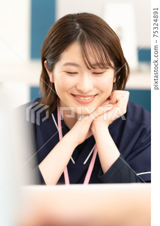 Young woman in medical staff 75324891