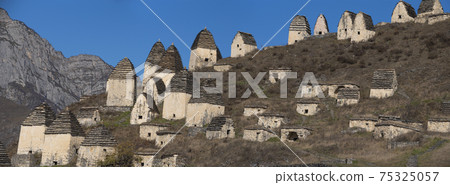 Dargavs is the city of the dead. Medieval necropolis in the Caucasus Mountains Dargavs is the city of the dead. Medieval necropolis in the Caucasus Mountains 75325057