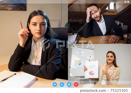 Young colleagues talking, working in videoconference with co-workers at office or living room. Online business, education during quarantine. 75325305