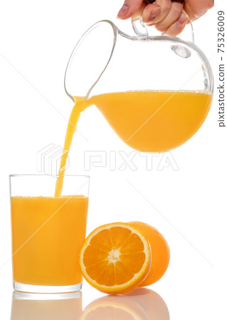 Orange juice in pitcher. Isolated on white background Stock Photo