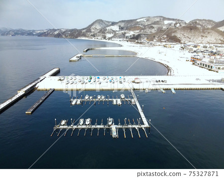 Aerial view of the snow scene of Toyoura fishing port in Toyoura-cho, Hokkaido in early spring Aerial view of the snow scene of Toyoura fishing port in Toyoura-cho, Hokkaido in early spring 75327871
