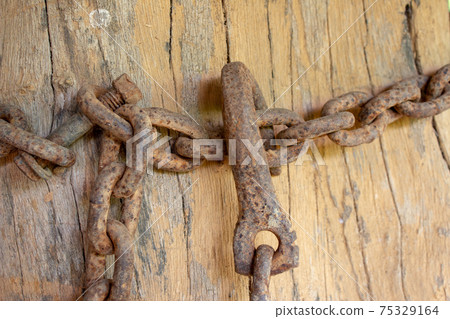 Old, rusted, corroded chain used on a farm Old, rusted, corroded chain used on a farm 75329164