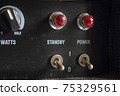 Buttons, knobs and lights of a guitar amplifier 75329561