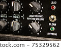 Buttons, knobs and lights of a guitar amplifier 75329562
