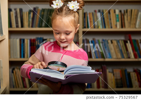 awesome little girl in casual wear in library after school awesome little girl in casual wear in library after school 75329567