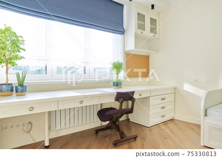 Interior, white furniture, table and chair near the window, cork board on wall Interior, white furniture, table and chair near the window, cork board on wall 75330813