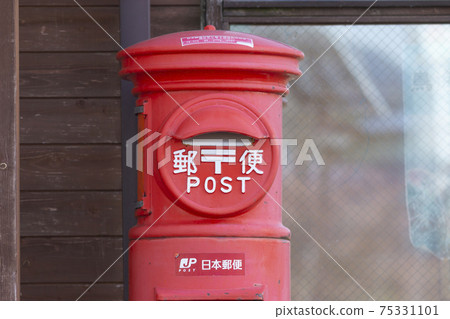 A bright red nostalgic mailbox A bright red nostalgic mailbox 75331101