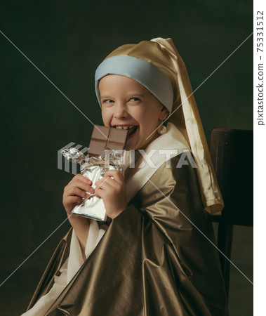 Medieval little girl as a lady with a pearl earring on dark studio background. Concept of comparison of eras, childhood. Stylish creative design, art vision, new look of artwork. Medieval little girl as a lady with a pearl earring on dark studio background. Concept of comparison of eras, childhood. Stylish creative design, art vision, new look of artwork. 75331512