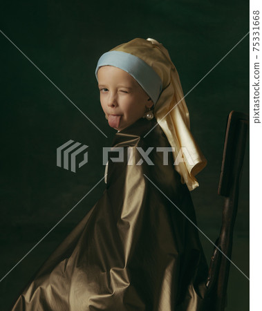 Medieval little girl as a lady with a pearl earring on dark studio background. Concept of comparison of eras, childhood. Stylish creative design, art vision, new look of artwork. 75331668