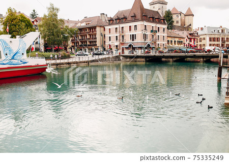 Annecy lake water channel bay with ducks view to marina from Annecy city 75335249