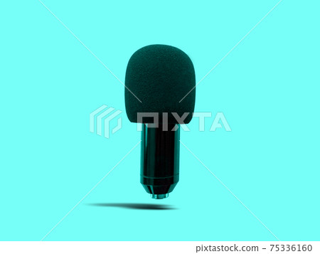 Floating Black Condenser Microphone with Foam Windshield isolated on Turquoise Background 75336160