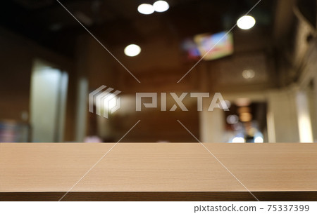 Empty dark wooden table in front of abstract blurred bokeh background of restaurant . can be used for display or montage your products.Mock up for space. Empty dark wooden table in front of abstract blurred bokeh background of restaurant . can be used for display or montage your products.Mock up for space. 75337399