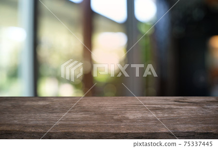 Empty dark wooden table in front of abstract blurred bokeh background of restaurant . can be used for display or montage your products.Mock up for space. Empty dark wooden table in front of abstract blurred bokeh background of restaurant . can be used for display or montage your products.Mock up for space. 75337445