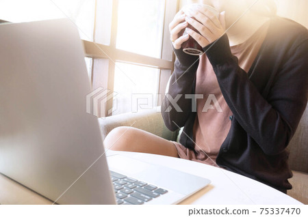 Woman working in cafe wearing protective mask. coronavirus COVID-19 Social distancing keep distance in public society people to protect COVID-19 Woman working in cafe wearing protective mask. coronavirus COVID-19 Social distancing keep distance in public society people to protect COVID-19 75337470