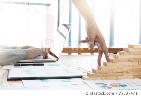 Success concept with business woman hand climbing wooden block stairs in Business Concept Success concept with business woman hand climbing wooden block stairs in Business Concept 75337471