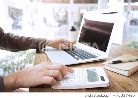 Man using, working on laptop with blank screen in meeting room. Man using, working on laptop with blank screen in meeting room. 75337480