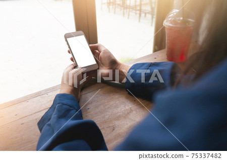 Women's hands holding cell telephone blank copy space screen. smart phone with technology concept. Women's hands holding cell telephone blank copy space screen. smart phone with technology concept. 75337482