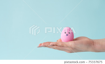 hunger charity egg drooling face on hand open palm 75337675