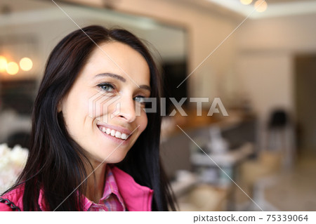 Beautiful face of a young woman in casual wear Beautiful face of a young woman in casual wear 75339064