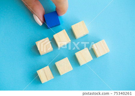 Woman hand putting and stacking blank wooden cubes on desk with copy space for input wording and infographic icon. Woman hand putting and stacking blank wooden cubes on desk with copy space for input wording and infographic icon. 75340261