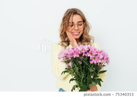 Beautiful happy young blonde woman wearing eyeglasses Beautiful happy young blonde woman wearing eyeglasses 75340353