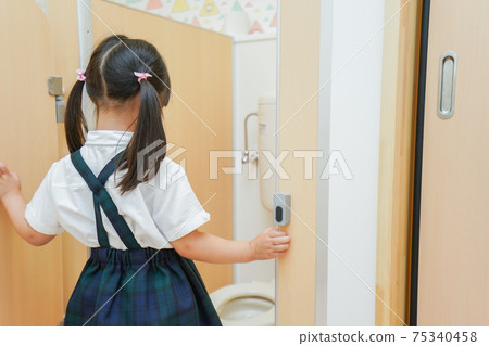 Children doing potty training in kindergarten 75340458