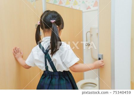 Children doing potty training in kindergarten Children doing potty training in kindergarten 75340459