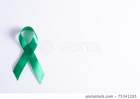 World kidney day, green ribbon awareness of kidney disease isolated white background. 75341285