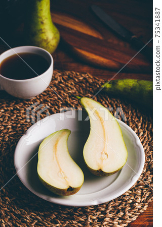 Halved Conference Pear on Plate Halved Conference Pear on Plate 75341887