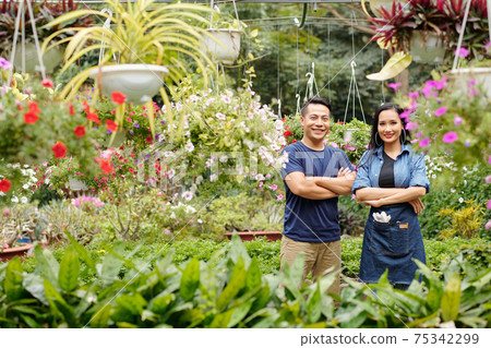 Happy couple in flower nursery Happy couple in flower nursery 75342299