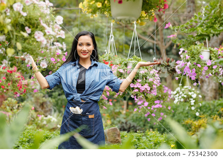Welcoming customers in flower nursery Welcoming customers in flower nursery 75342300