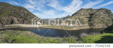 Panoramic view of sweet water dam Presa de Los Perez lake in Tamadaba nature park. Gran Canaria, Canary Islands, Spain 75342330
