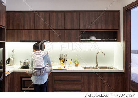 Mother cooking dinner 75342457