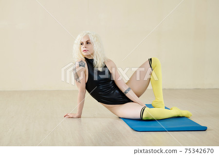 Pensive fit female dancer Pensive fit female dancer 75342670