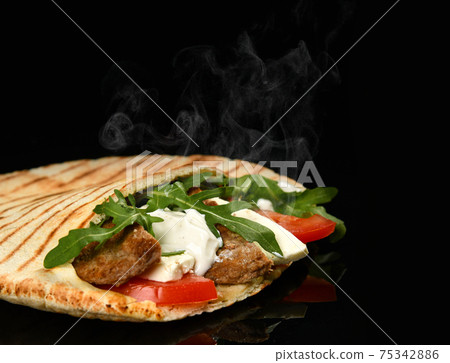 Classic tortilla wrap roll with grilled beef and Classic tortilla wrap roll with grilled beef and 75342886