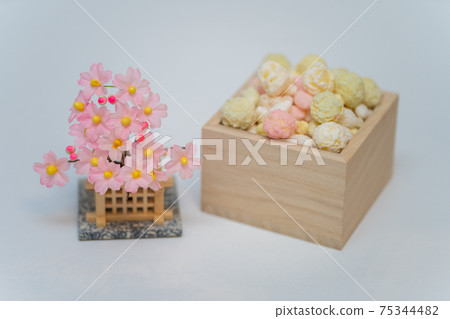 Colorful hina-arare and cherry tree in a wooden box 75344482