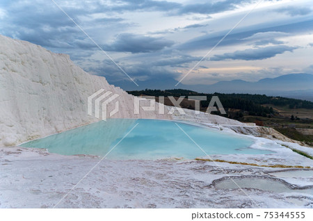 Scenic view of Pamukkale in Turkey on sunny day Scenic view of Pamukkale in Turkey on sunny day 75344555