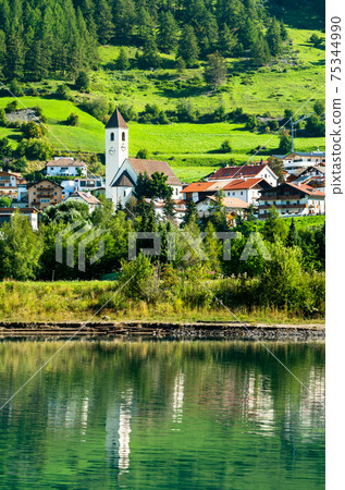 Church at Graun im Vinschgau or Curon Venosta, a town on Lake Reschen in South Tyrol, Italy Church at Graun im Vinschgau or Curon Venosta, a town on Lake Reschen in South Tyrol, Italy 75344990