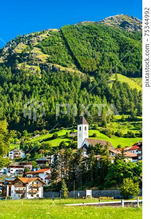 Church at Graun im Vinschgau or Curon Venosta, a town on Lake Reschen in South Tyrol, Italy 75344992
