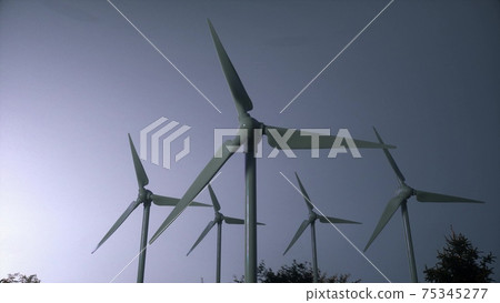 Wind turbine farm on beautiful cloudy sky background. Renewable energy production for green ecological world. 3d illustration Wind turbine farm on beautiful cloudy sky background. Renewable energy production for green ecological world. 3d illustration 75345277