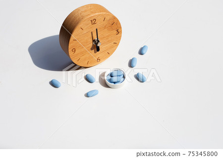 PrEP ( Pre-Exposure Prophylaxis) used to prevent HIV with wooden clock 75345800